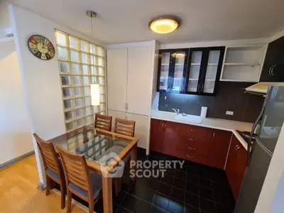 Charming kitchen with modern dining area and sleek cabinetry