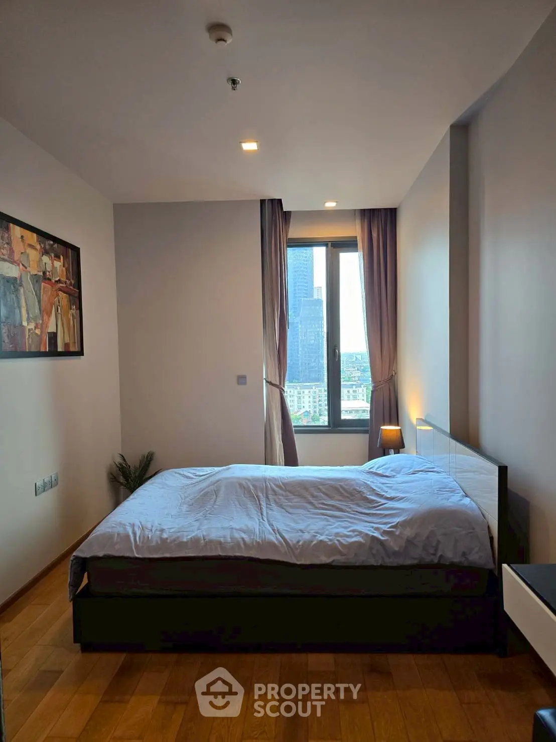 Modern bedroom with city view and stylish decor