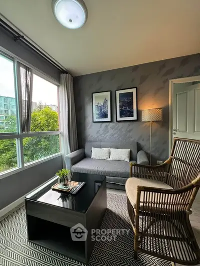 Cozy living room with modern decor and large window view