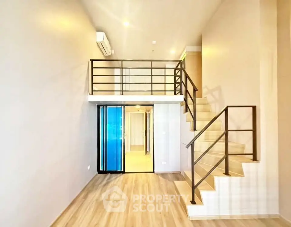 Modern loft apartment with mezzanine and sleek staircase