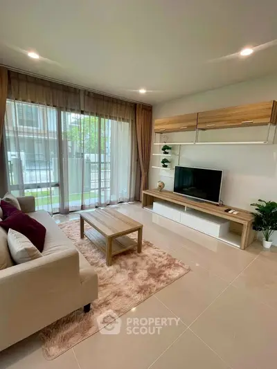 Modern living room with large windows and stylish furniture