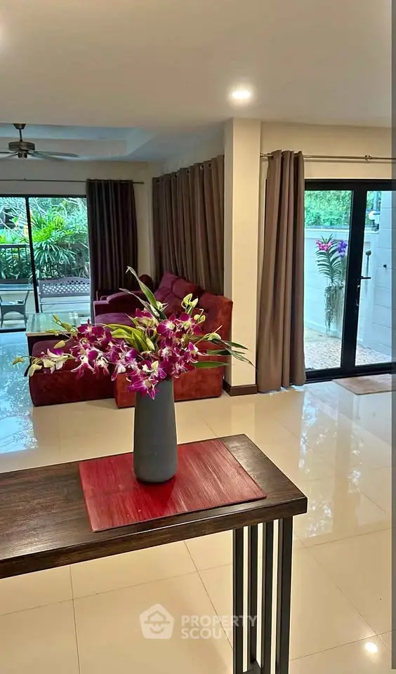 Spacious living room with modern decor and garden view