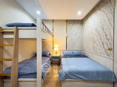 Modern bedroom with stylish bunk beds and elegant wall design