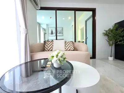 Modern living room with glass sliding doors and stylish decor