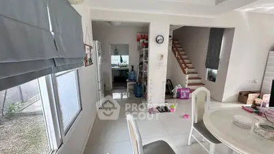 Spacious dining area with modern decor and garden view