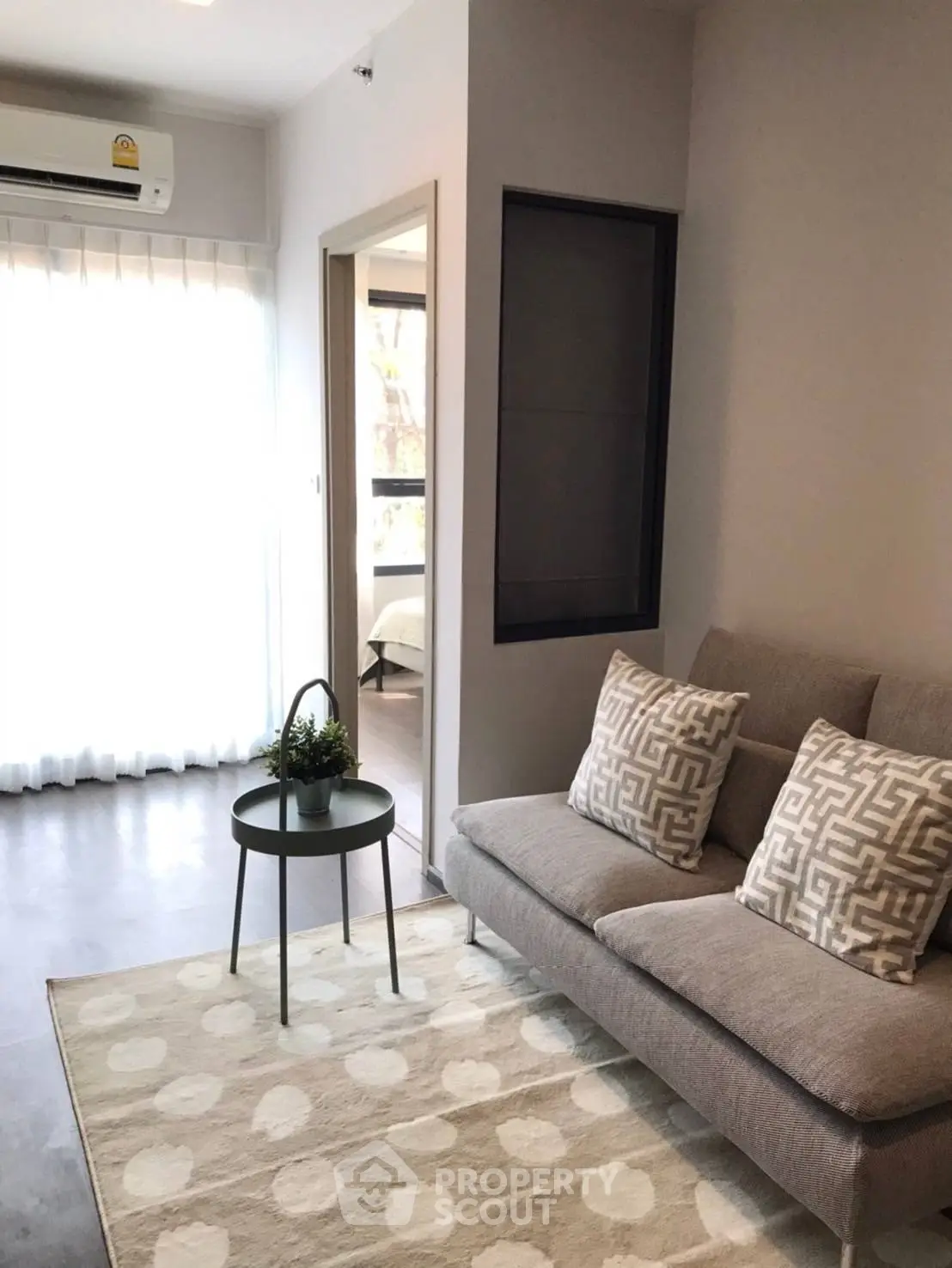 Modern living room with stylish sofa and natural light