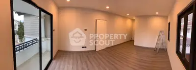 Spacious unfurnished room with balcony access and modern lighting, perfect for customization.