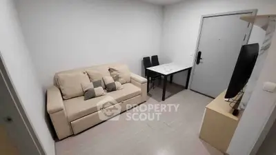 Cozy living room with beige sofa and modern decor