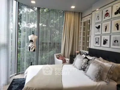 Stylish bedroom with floor-to-ceiling windows and chic decor
