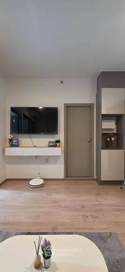 Modern living room with wall-mounted TV and stylish decor