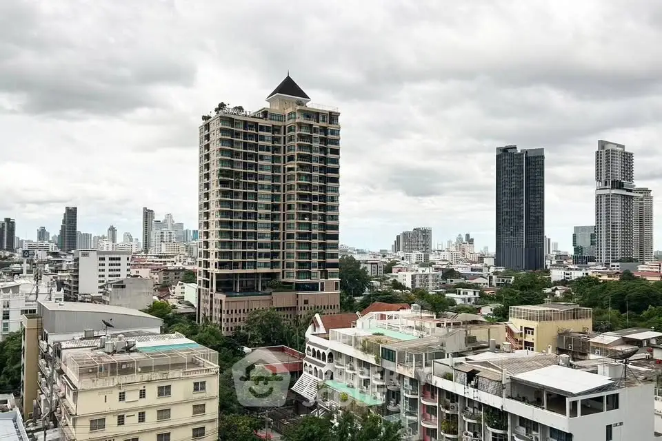 Stunning cityscape view showcasing modern high-rise buildings and lush greenery in an urban setting.