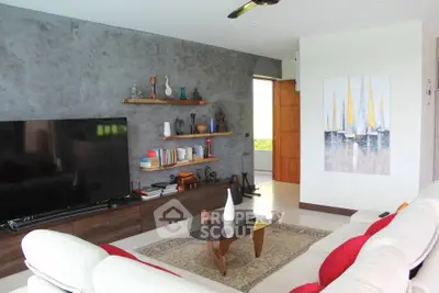 Stylish modern living room with large TV and artistic decor