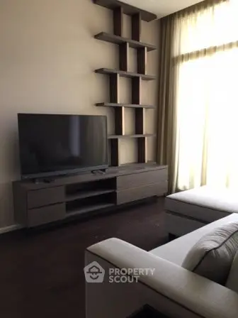 Modern living room with sleek TV stand and stylish shelving unit