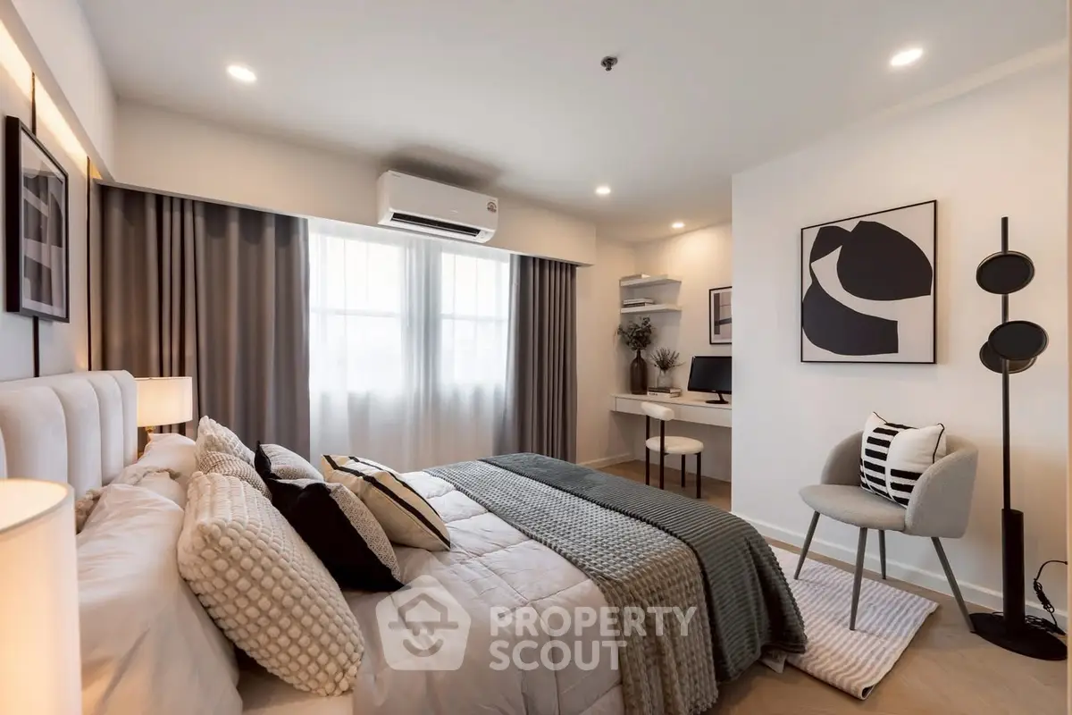 Modern bedroom with stylish decor, cozy bed, and elegant workspace, perfect for comfort and productivity.
