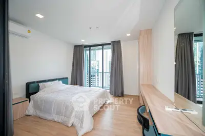 Modern bedroom with balcony view in a stylish apartment