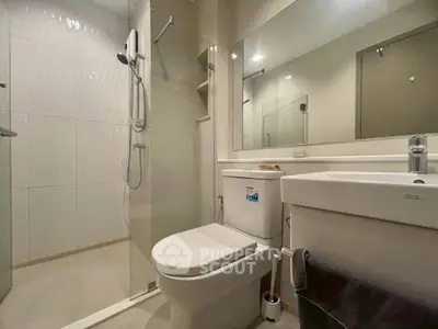 Modern bathroom with glass shower and sleek fixtures