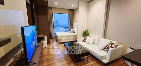 Modern studio apartment with wooden flooring and city view