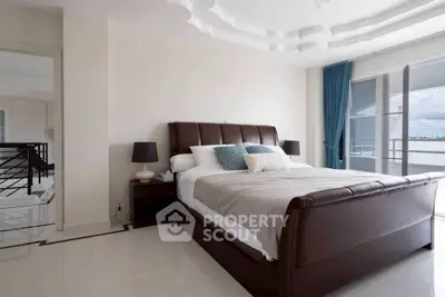 Luxurious bedroom with elegant decor and stunning balcony view