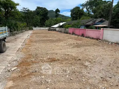 Spacious land plot ready for development in a serene neighborhood with lush greenery.