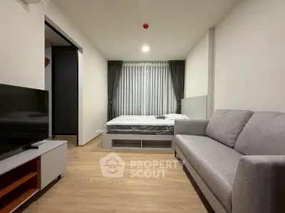 Modern studio apartment with cozy living area and natural light