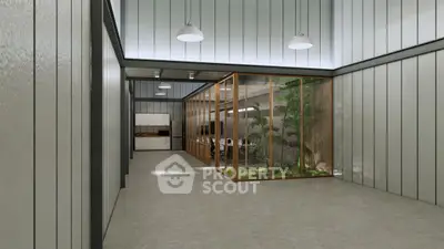 Modern industrial interior with glass-enclosed garden and sleek kitchen area.