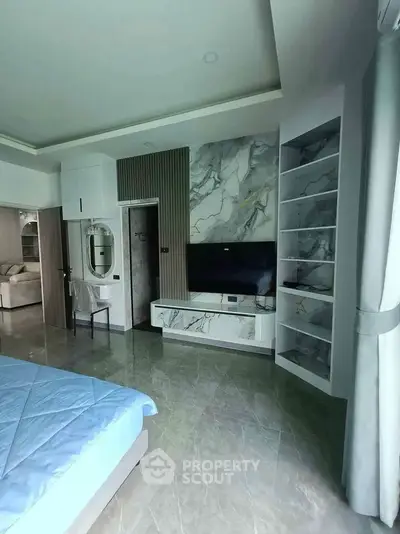 Luxurious bedroom with modern marble accents and built-in storage