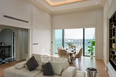 Luxurious living room with elegant dining area and stunning bridge view.