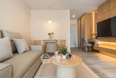 Modern living room with cozy seating, stylish decor, and ambient lighting in a contemporary apartment.