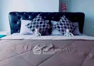 Luxurious bedroom with plush bedding and stylish decor for ultimate comfort.