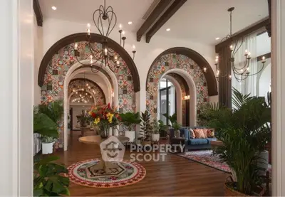 Luxurious living room with elegant arches and vibrant decor