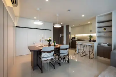 Modern dining and kitchen area with elegant decor and open layout