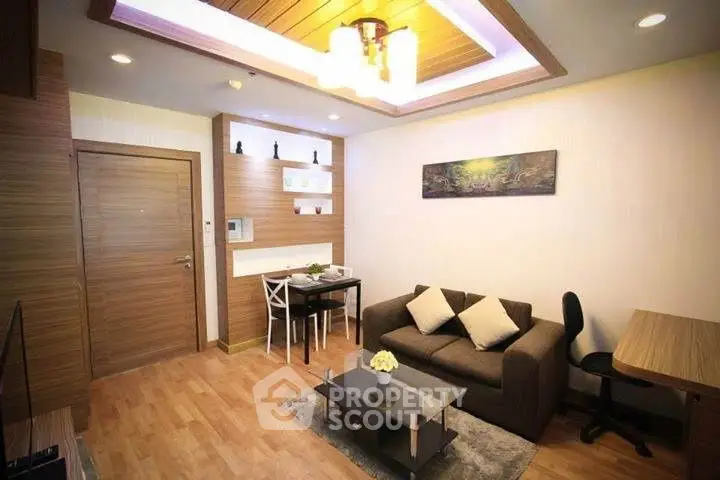 Modern living room with cozy sofa, dining area, and stylish decor
