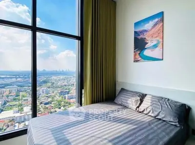 Stunning bedroom with panoramic city view and elegant decor