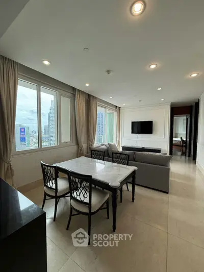Spacious living room with elegant dining area and city view, perfect for modern urban living.