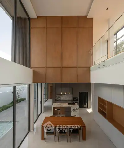 Luxurious modern dining area with high ceilings and pool view, featuring elegant wooden accents and sleek design.