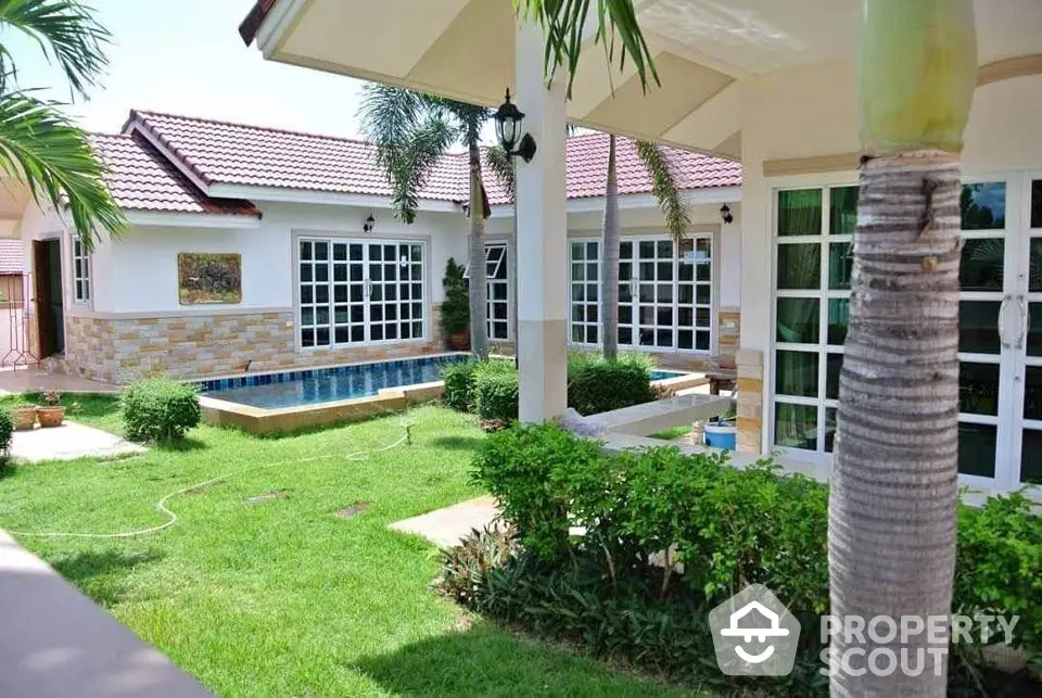 Charming single-story home with lush garden and private pool, perfect for relaxation and entertaining.