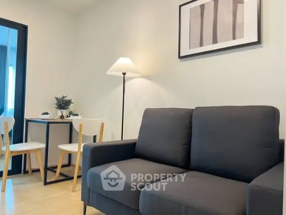 Modern living room with cozy sofa and stylish dining area