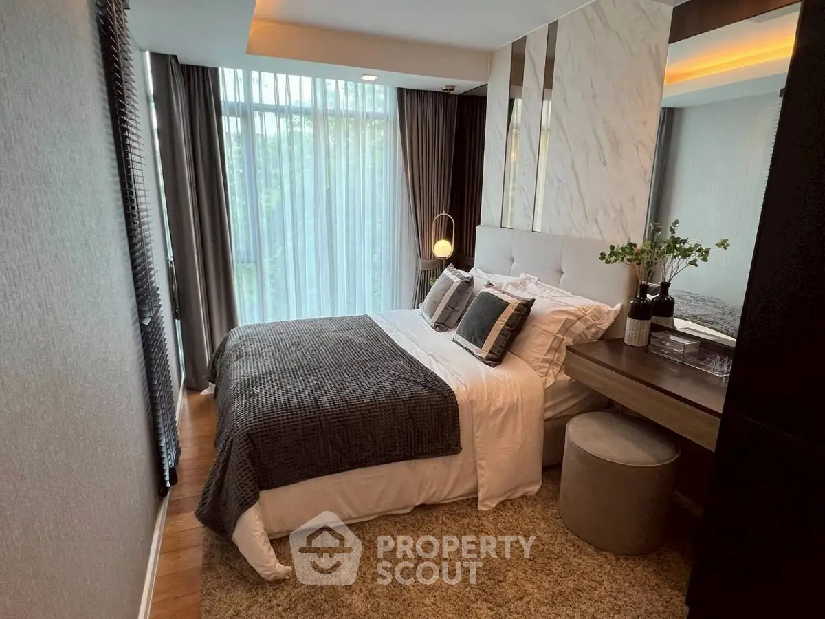 Luxurious bedroom with elegant decor and large window view