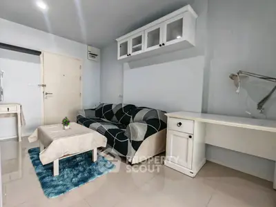 Cozy living room with modern sofa and sleek white furniture