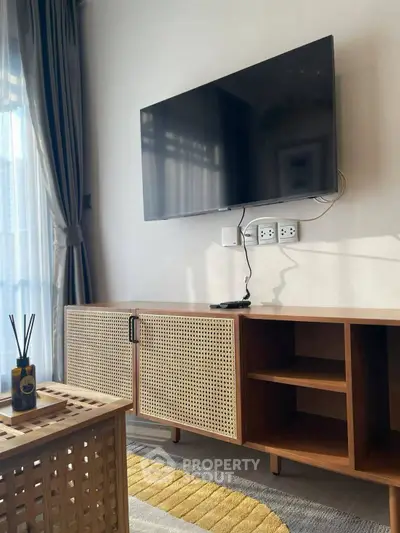 Modern living room with stylish TV setup and elegant furniture