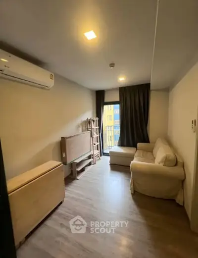 Cozy living room with natural light and modern furnishings