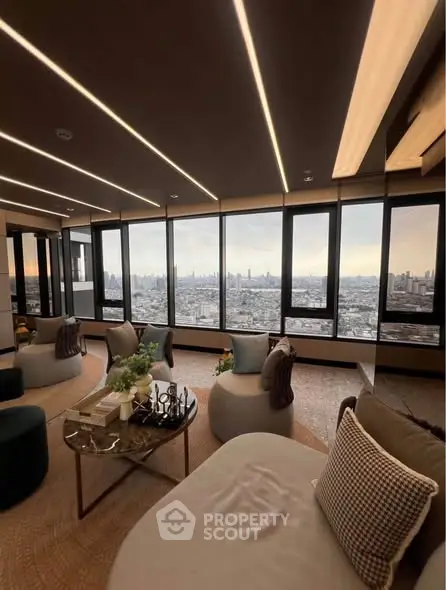 Luxurious living room with panoramic city view and modern furnishings.