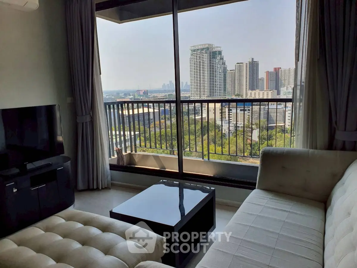 Modern living room with stunning city view from large window balcony