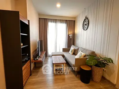 Stylish living room with modern decor and cozy seating area, perfect for relaxation.