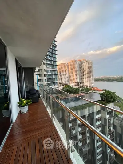 Stunning high-rise balcony with breathtaking city and river views, perfect for relaxation and entertainment.