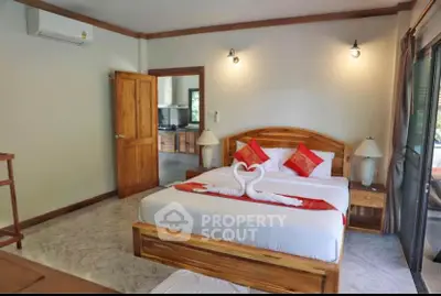 Spacious bedroom with elegant wooden furniture and cozy decor