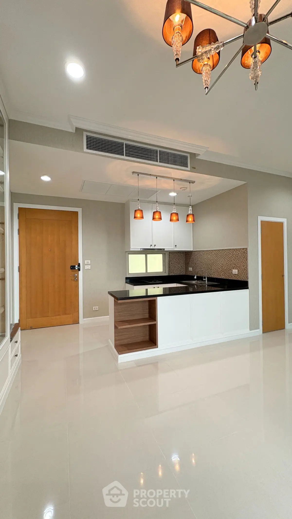 Spacious modern kitchen with elegant lighting and open layout