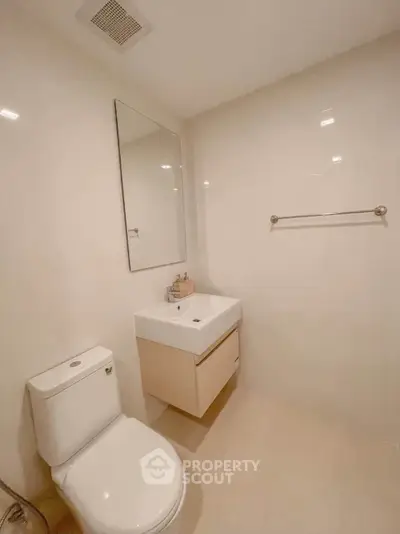 Modern minimalist bathroom with sleek fixtures and neutral tones