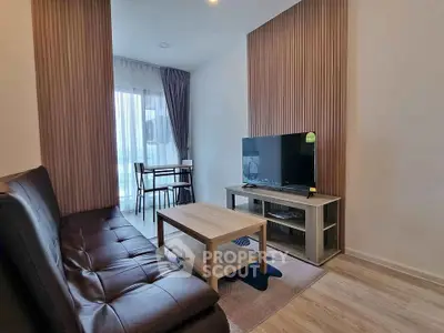 Modern living room with sleek furniture and natural light, perfect for urban living.