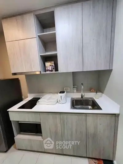 Modern kitchen with sleek cabinetry and built-in appliances